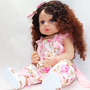 عروسک سیلیکونی دختر بچه 50 سانتی سخنگو با گل سر صورتی_اسباب بازی