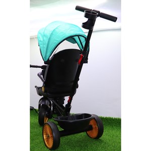 سه چرخه فلزی با سایه بان رنگ فیروزه ای