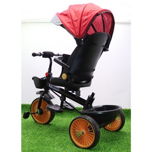 سه چرخه فلزی با سایه بان رنگ قرمز